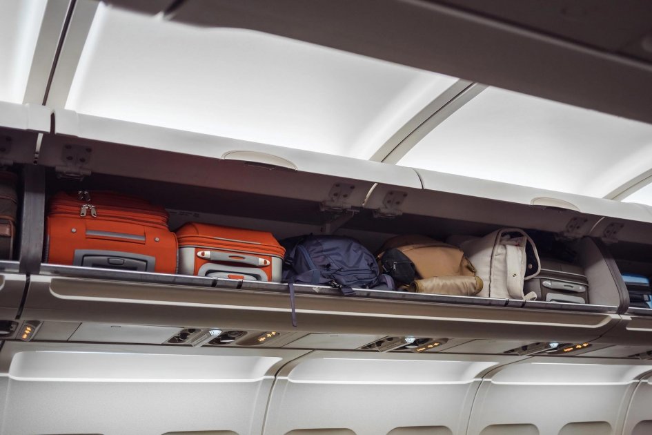 A shelf for passengers' carry-on luggage in the aircraft cabin