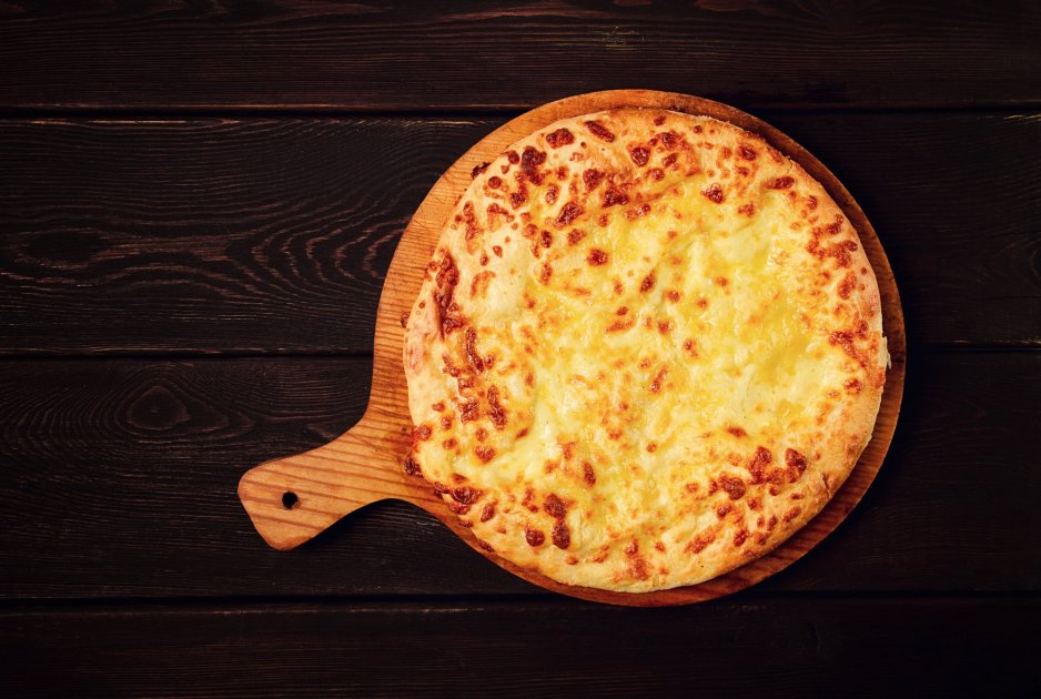 Khachapuri with melted cheese and an egg