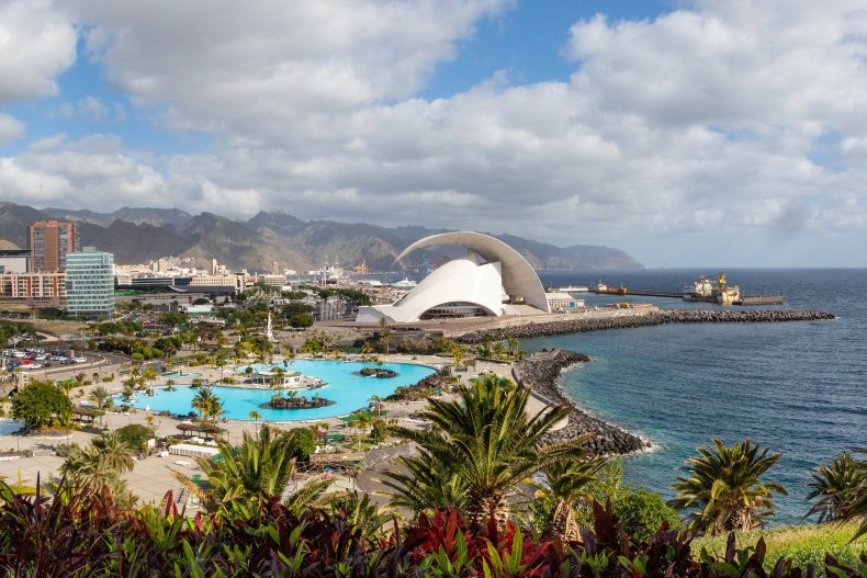 Santa Cruz cityscape view with park, ocean and mountains on the background on the sunrise, Canary islands, Spain