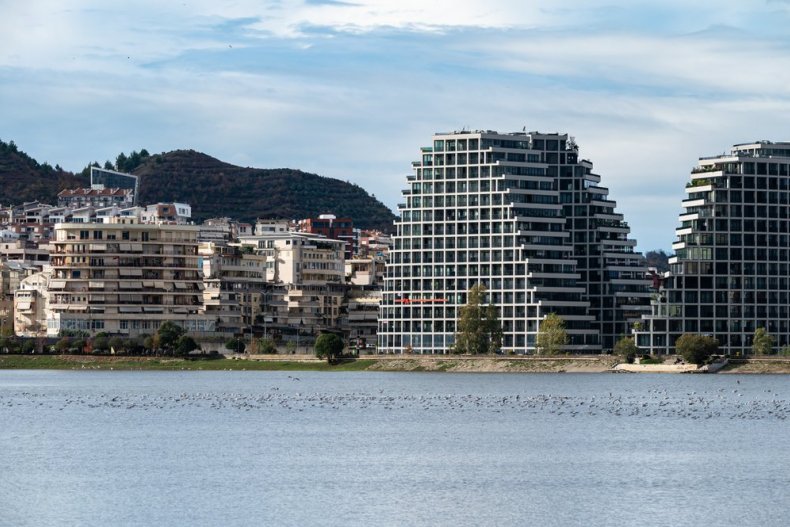 Landscape view of the city, artificial lake, and Tirana Park