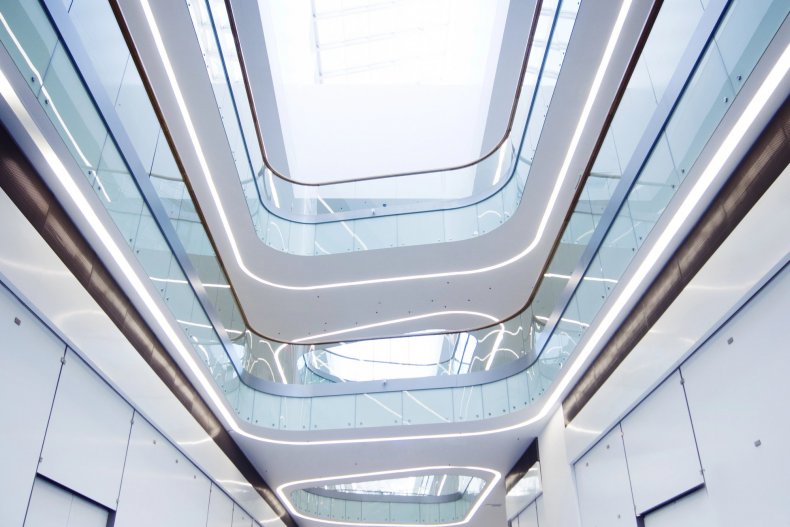 A bright, modern shopping center with an atrium and stores