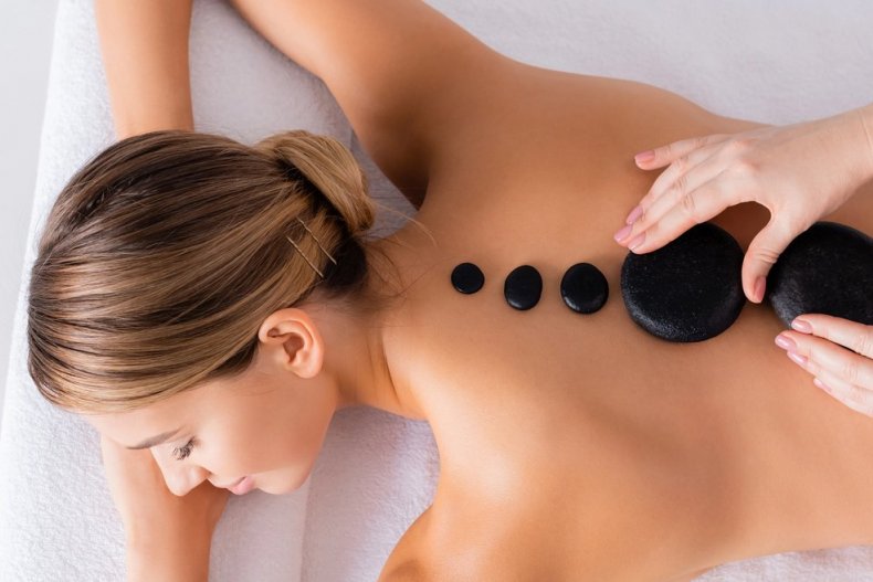 Hot stone massage treatment at a spa salon
