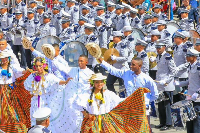 Musicians and dancers in traditional costumes at a festive performance
