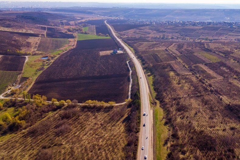 An aerial view of a road between fields in Moldova